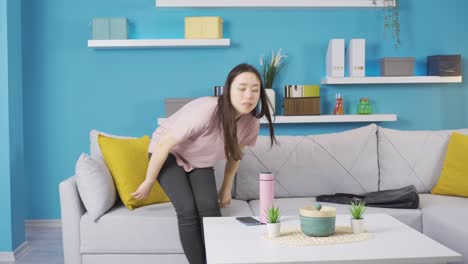 Young-asian-woman-with-bad-smell-in-socks-is-disgusted-by-the-smell.